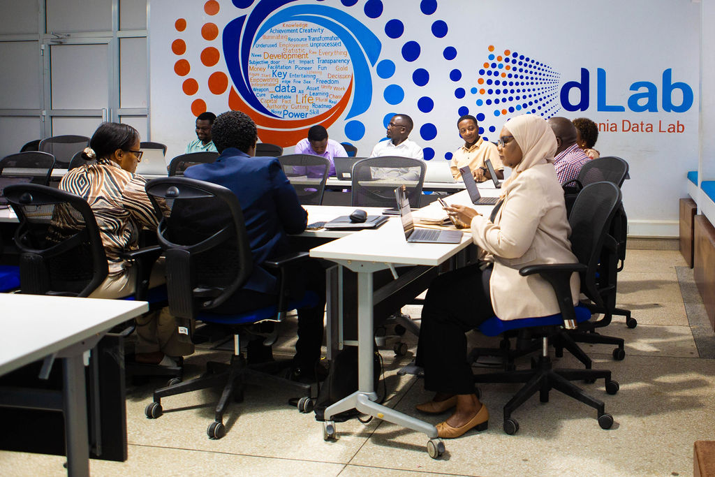 Stakeholders discussing the future adoption of AI-generated Kiswahili STEM content at CoICT DLab