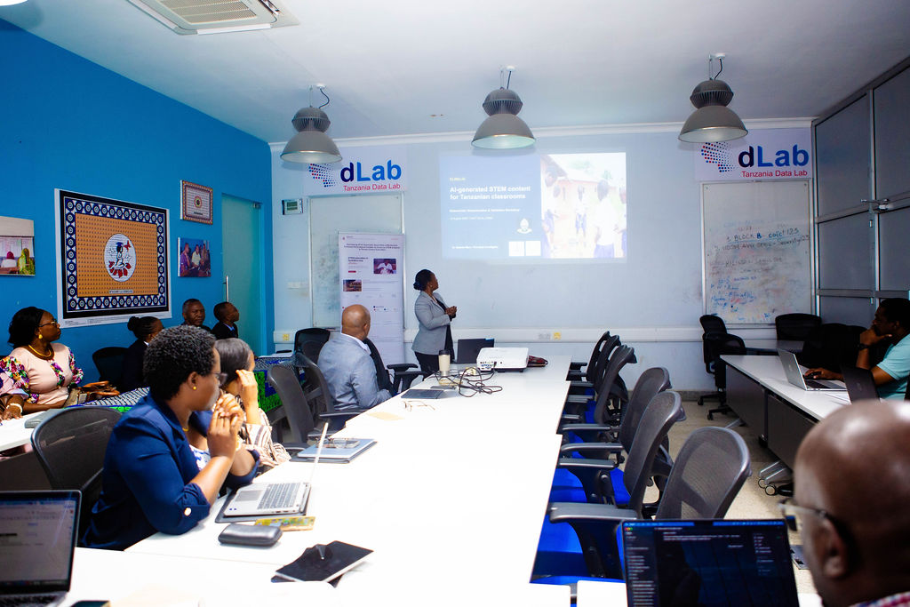 A presenter demonstrating AI-generated Kiswahili STEM content to workshop participants